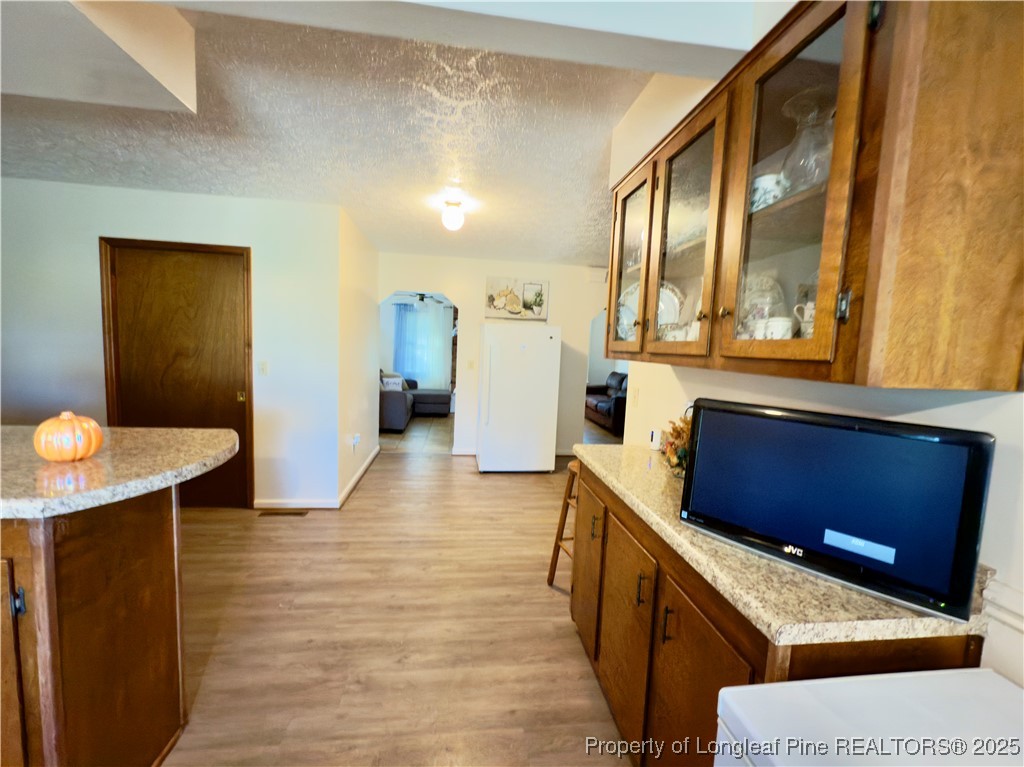 4506 Tobacco Road Orrum, NC 28369 - Photo 7 of 46 a kitchen with a refrigerator and sink