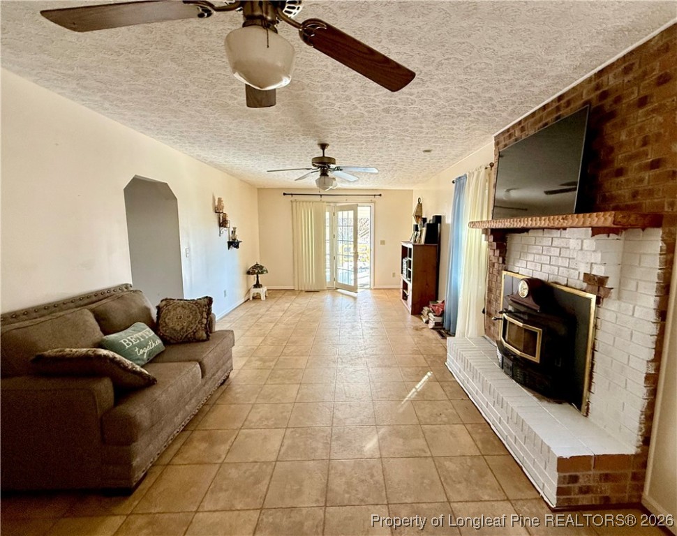 4506 Tobacco Road Orrum, NC 28369 - Photo 10 of 46 a living room with furniture and a flat screen tv
