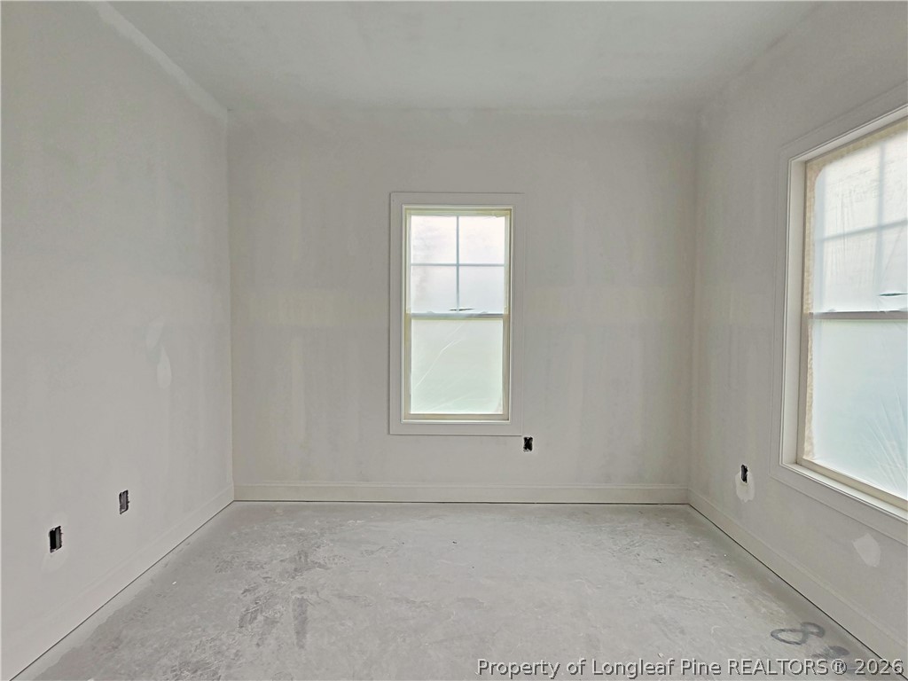 2650 Norrington Road Lillington, NC 27546 - Photo 5 of 24 an empty room with a window