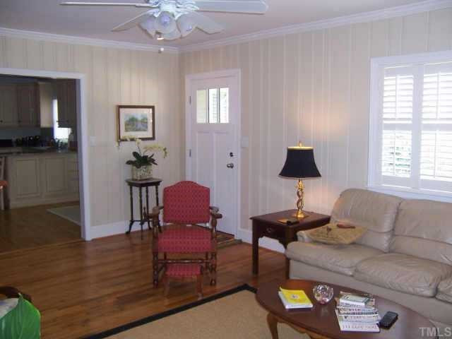 109 West Whitaker Mill Road Raleigh, NC 27608 - Photo 3 of 10 a living room with furniture and a wooden floor