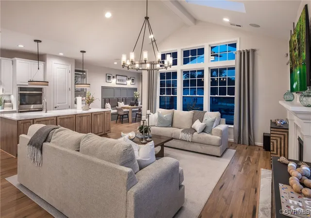 a living room with furniture fireplace and flat screen tv