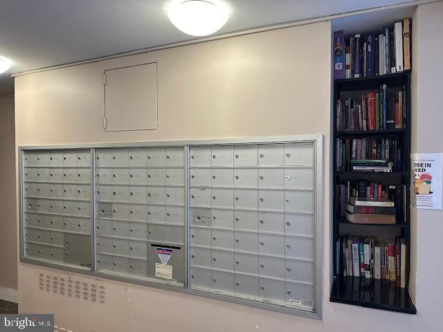 1260 21st Street Northwest, Unit 309 Washington, DC 20036 - Photo 14 of 16 a view of a book shelf in a room