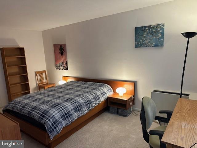 1260 21st Street Northwest, Unit 309 Washington, DC 20036 - Photo 6 of 16 a bedroom with a bed window and a flat screen tv