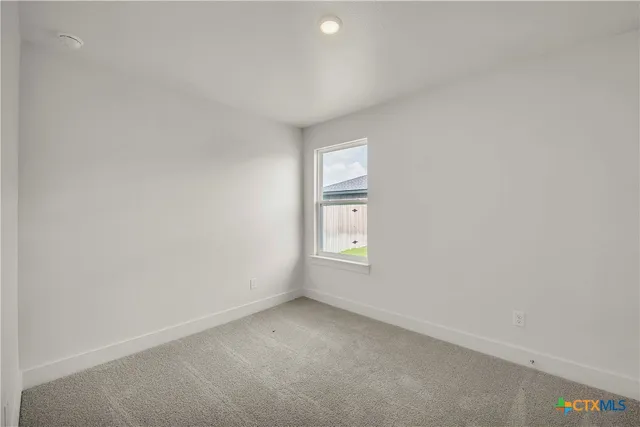 a view of front door of house with yard
