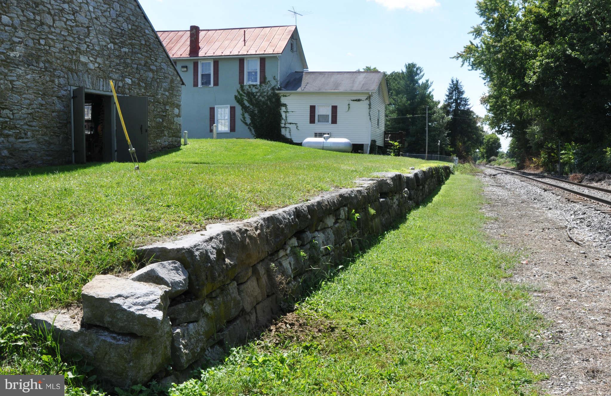 2985 Summit Point Road Summit Point, WV 25446 - Photo 5 of 30 a view of a house with a backyard and a garden