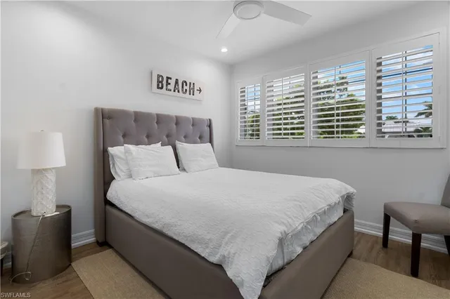 a bedroom with bed and a window