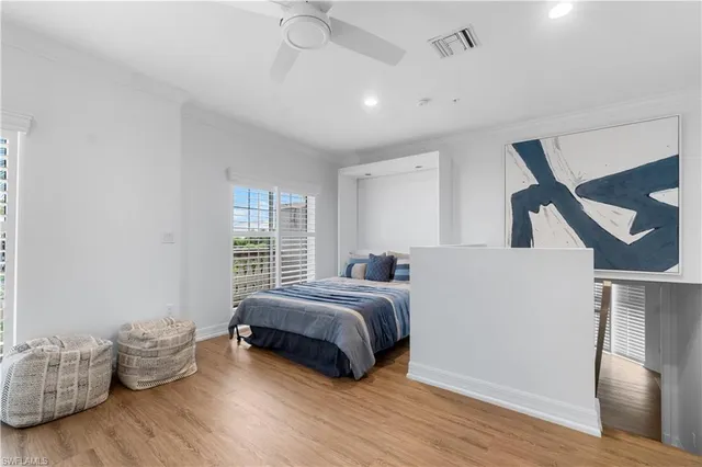 a bedroom with bed and window