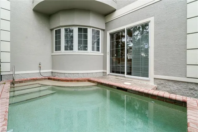 a view of a house with a swimming pool