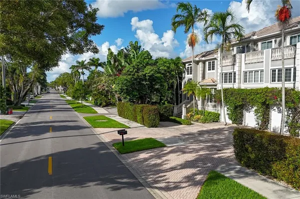 a view of a street with a building in the background