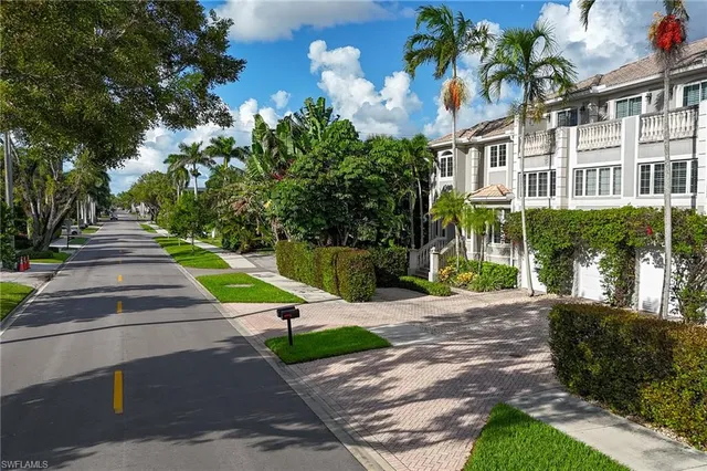 a view of a street with a building in the background