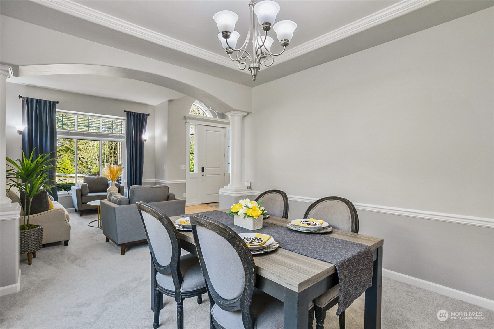 2732 233rd Place Southeast Bothell, WA 98021 - Photo 20 of 40 a view of a dining room with furniture a chandelier and a window