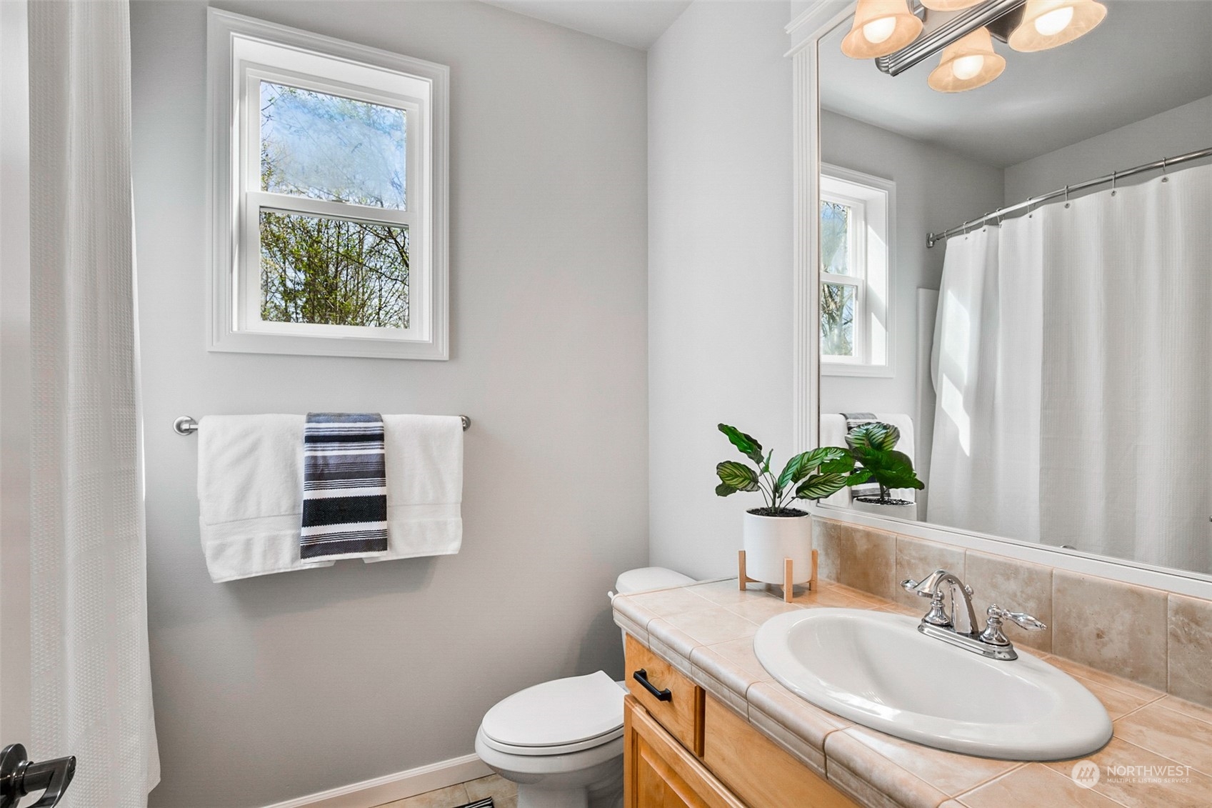 2732 233rd Place Southeast Bothell, WA 98021 - Photo 23 of 40 a bathroom with a sink toilet and a mirror