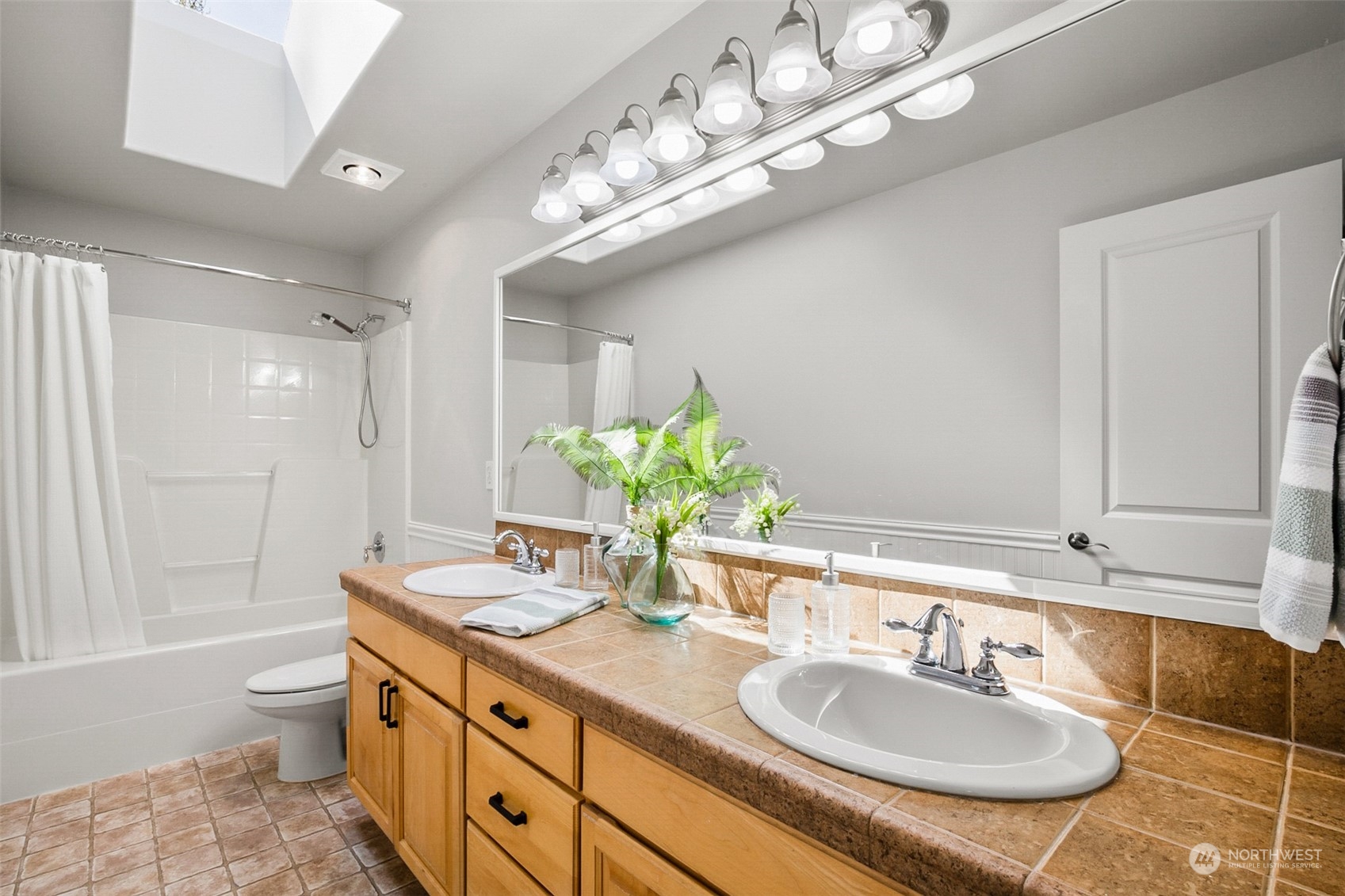 2732 233rd Place Southeast Bothell, WA 98021 - Photo 33 of 40 a bathroom with a granite countertop double vanity and a mirror