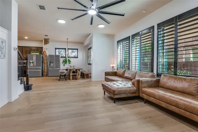 a living room with furniture and large window