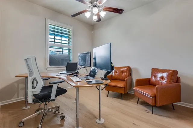 a work room with furniture and wooden floor