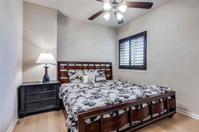 a bedroom with a bed and a lamp