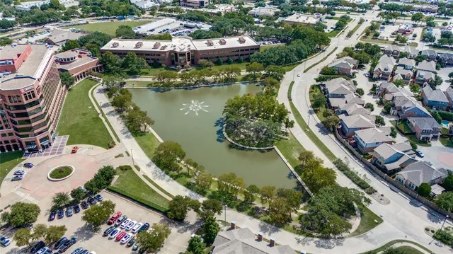 an aerial view of a house with a lake view