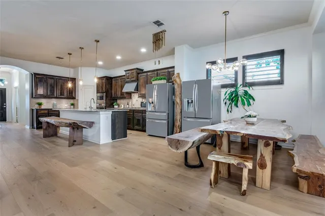 a living room with furniture and kitchen view
