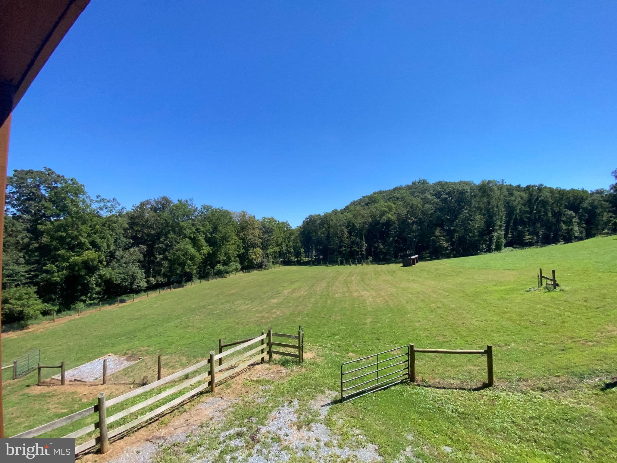 15 Davidson Road West Chester, PA 19382 - Photo 36 of 36 Expansive green fields under a clear blue sky.
