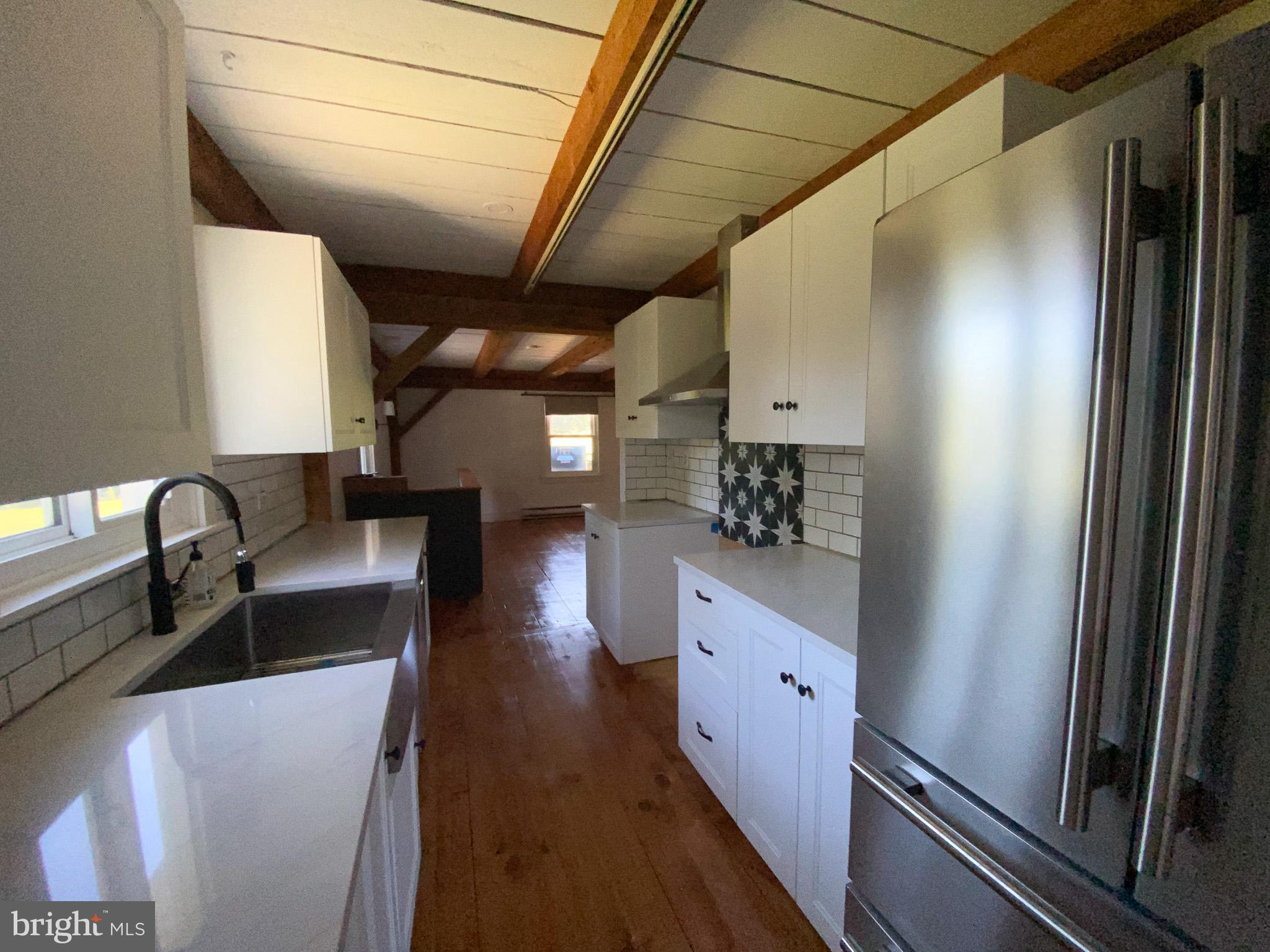 15 Davidson Road West Chester, PA 19382 - Photo 6 of 36 Charming kitchen with rustic wooden beams.