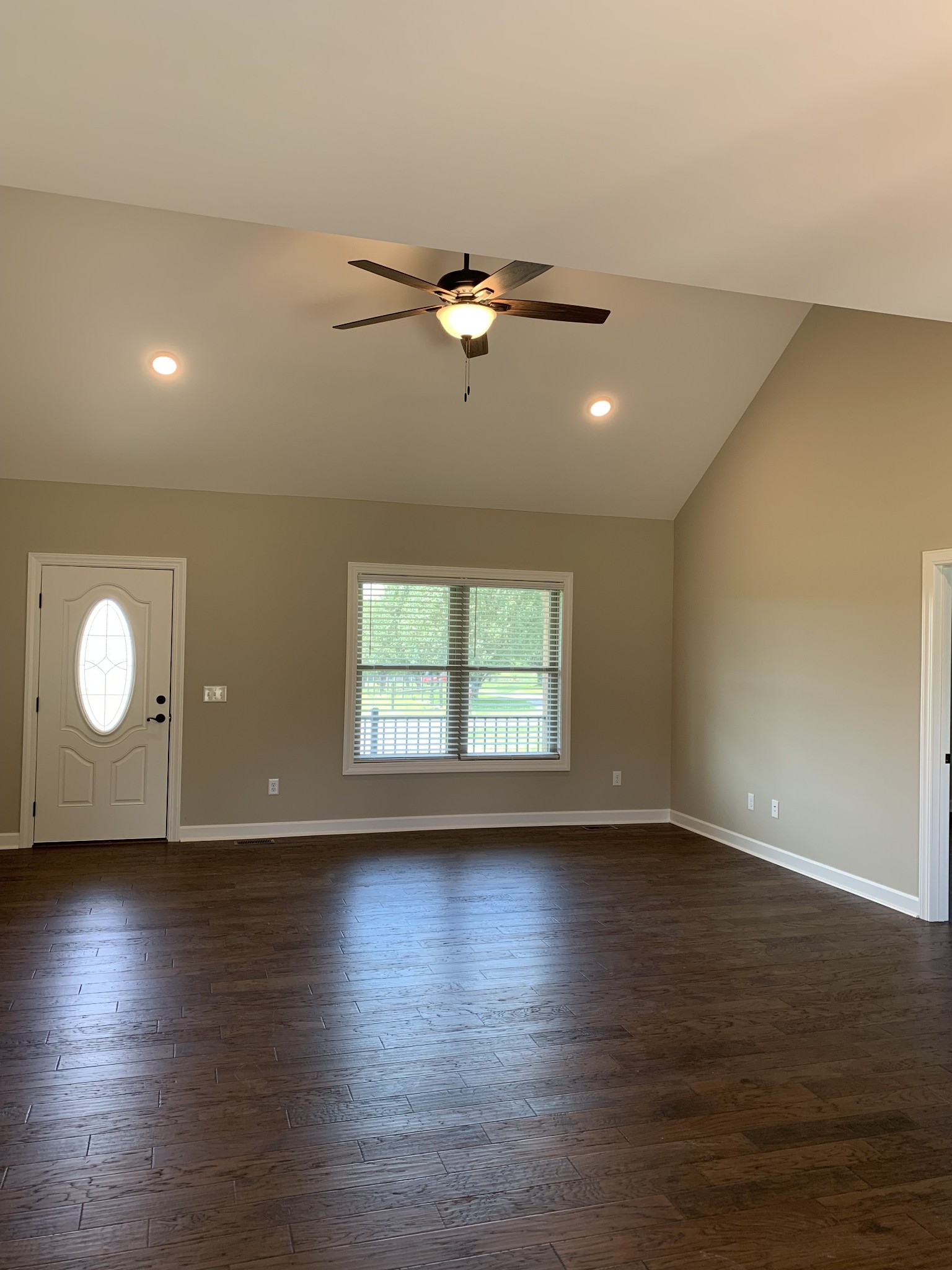 589 Womack Road Bethpage, TN 37022 - Photo 11 of 20 a view of an empty room with wooden floor and a window