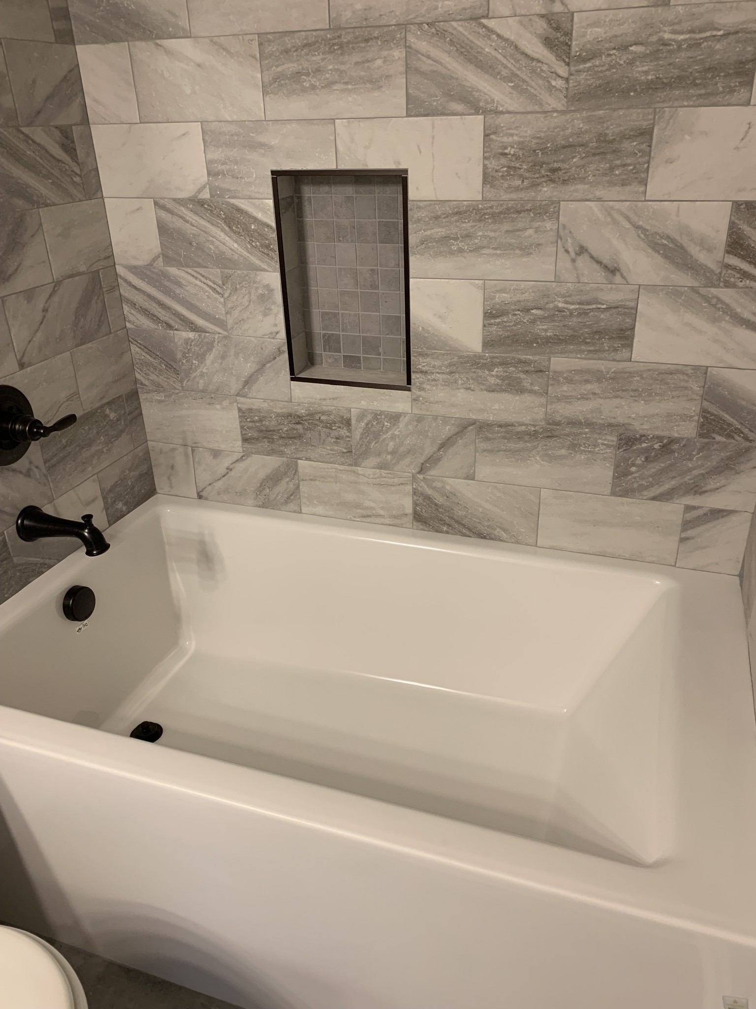 589 Womack Road Bethpage, TN 37022 - Photo 14 of 20 a bathroom with a bathtub