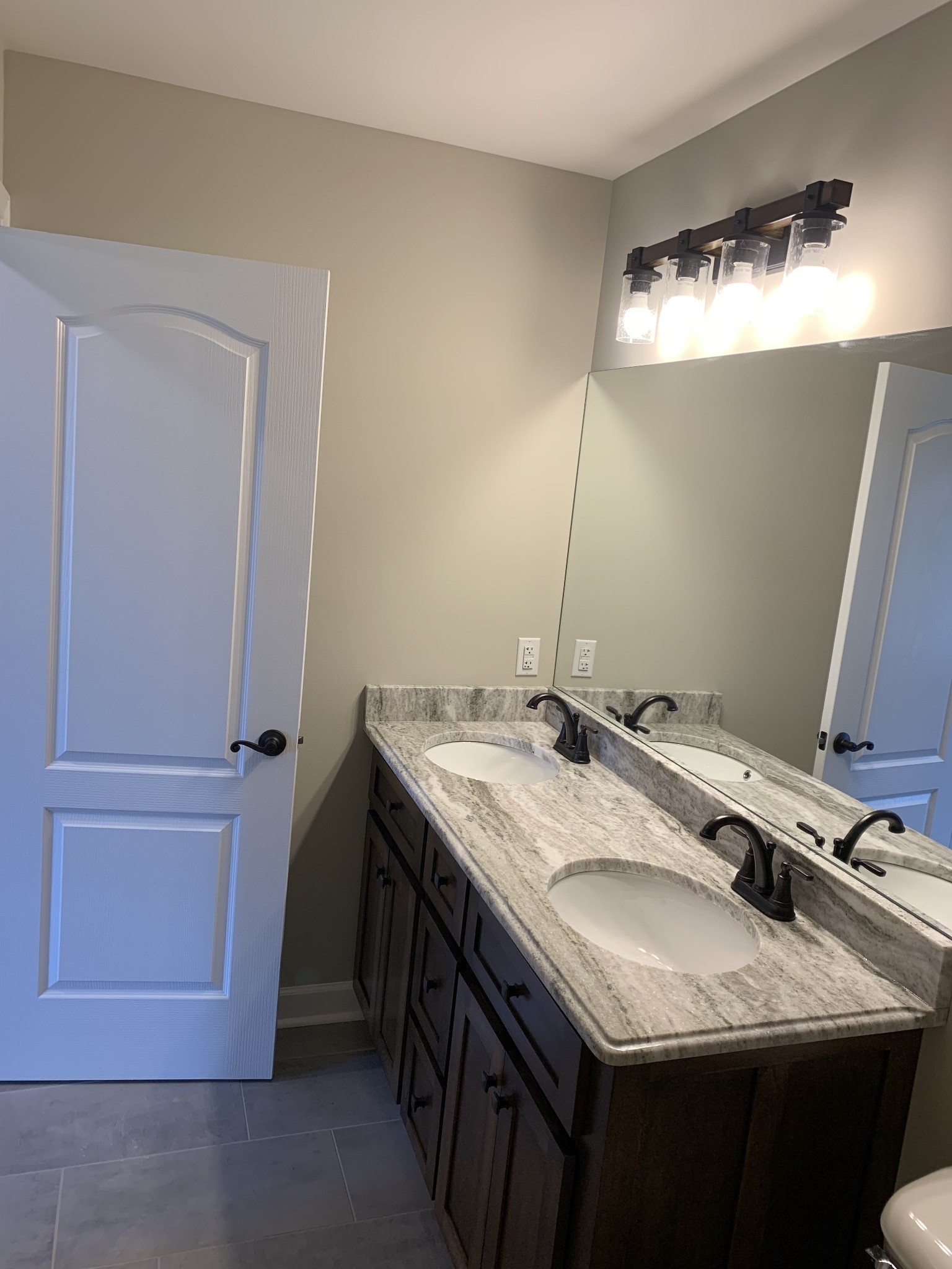 589 Womack Road Bethpage, TN 37022 - Photo 15 of 20 a bathroom with a granite countertop sink and a mirror