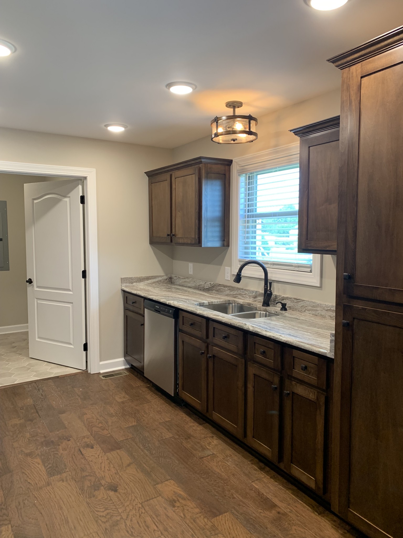 589 Womack Road Bethpage, TN 37022 - Photo 6 of 20 a spacious bathroom with a granite countertop sink a mirror and a shower