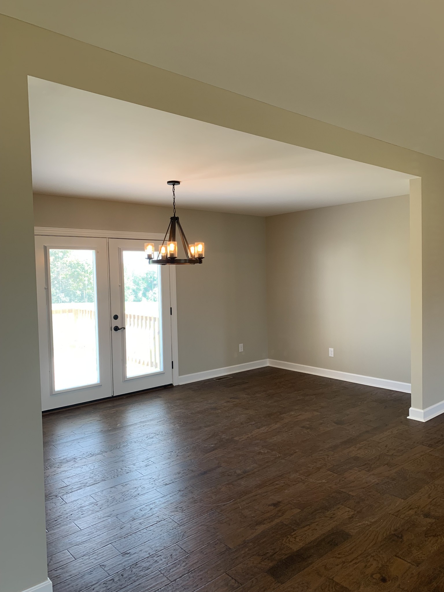 589 Womack Road Bethpage, TN 37022 - Photo 8 of 20 an empty room with wooden floor and windows