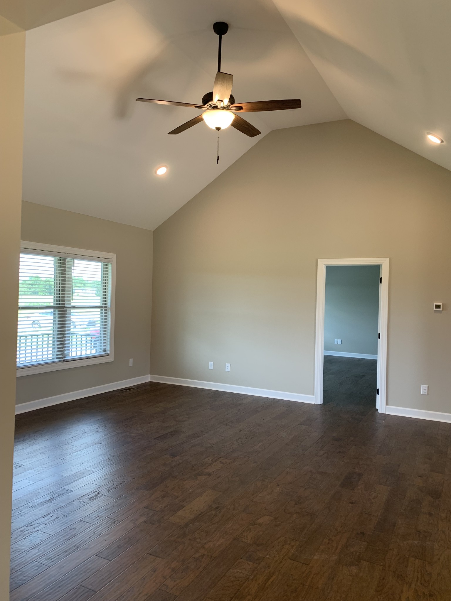 589 Womack Road Bethpage, TN 37022 - Photo 10 of 20 an empty room with wooden floor and windows