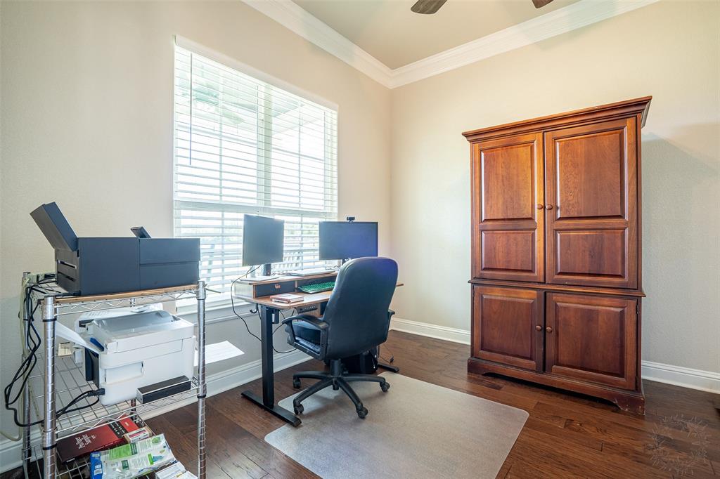 1920 Meander Road Granbury, TX 76049 - Photo 6 of 40 Spacious room with a large window featuring horizontal blinds, crown molding, wood-finish flooring, and a ceiling fan