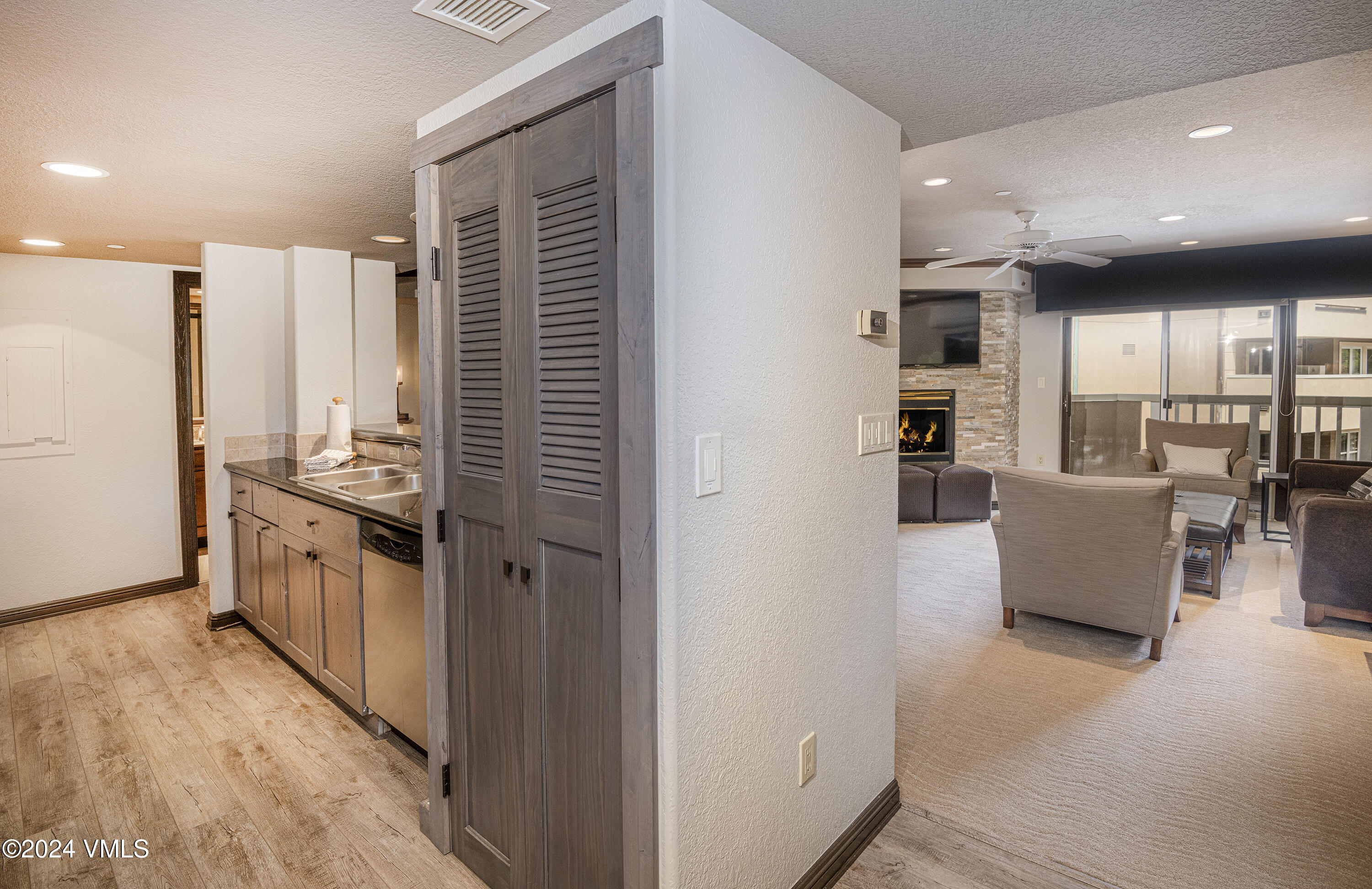 210 Offerson Road, Unit 212WEEK 51 Beaver Creek, CO 81620 - Photo 7 of 24 a kitchen with kitchen island stainless steel appliances a refrigerator cabinets and wooden floor