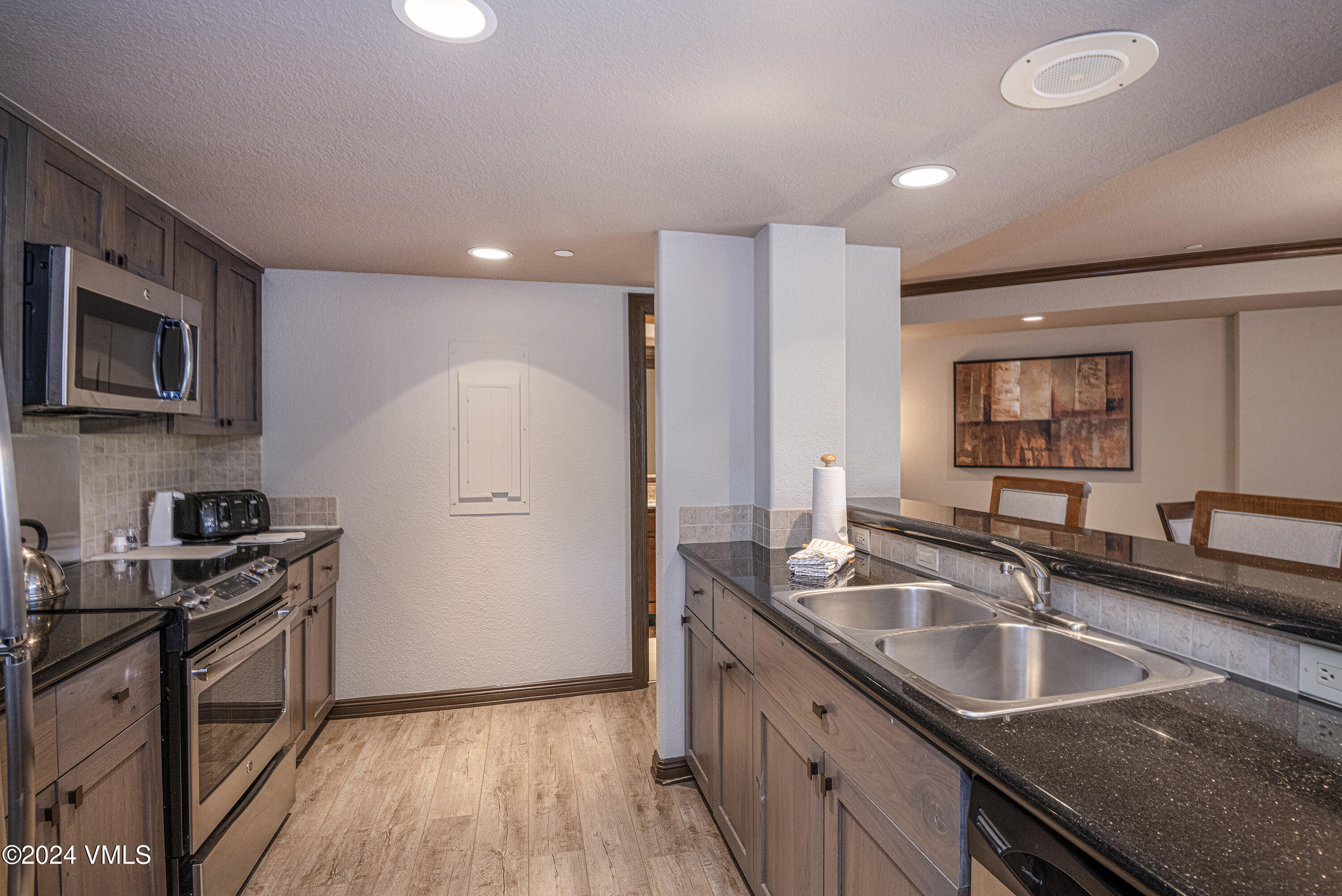 210 Offerson Road, Unit 212WEEK 51 Beaver Creek, CO 81620 - Photo 9 of 24 a kitchen that has a sink a stove and a refrigerator