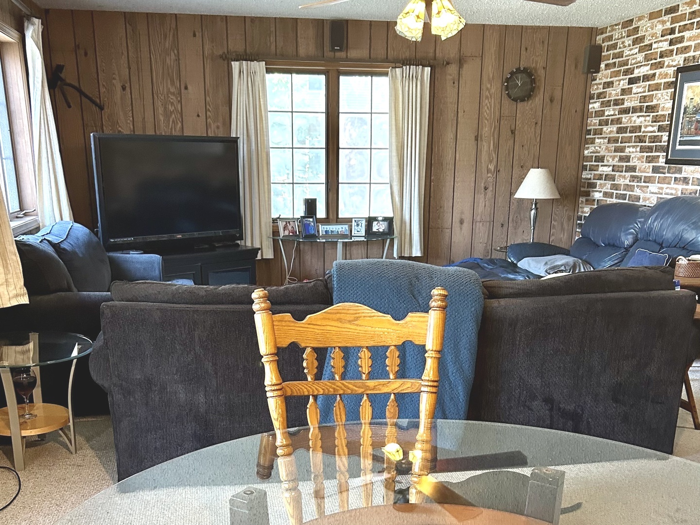 8542 School Street Morton Grove, IL 60053 - Photo 15 of 28 a living room with furniture and a flat screen tv