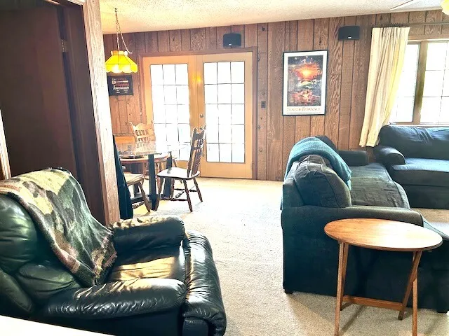 a living room with furniture and a table