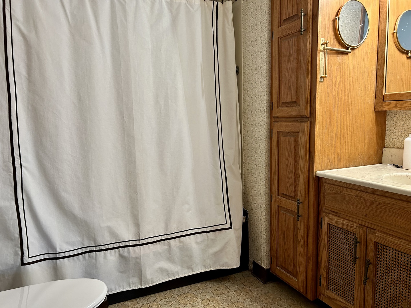 8542 School Street Morton Grove, IL 60053 - Photo 21 of 28 a bathroom with a sink and a mirror
