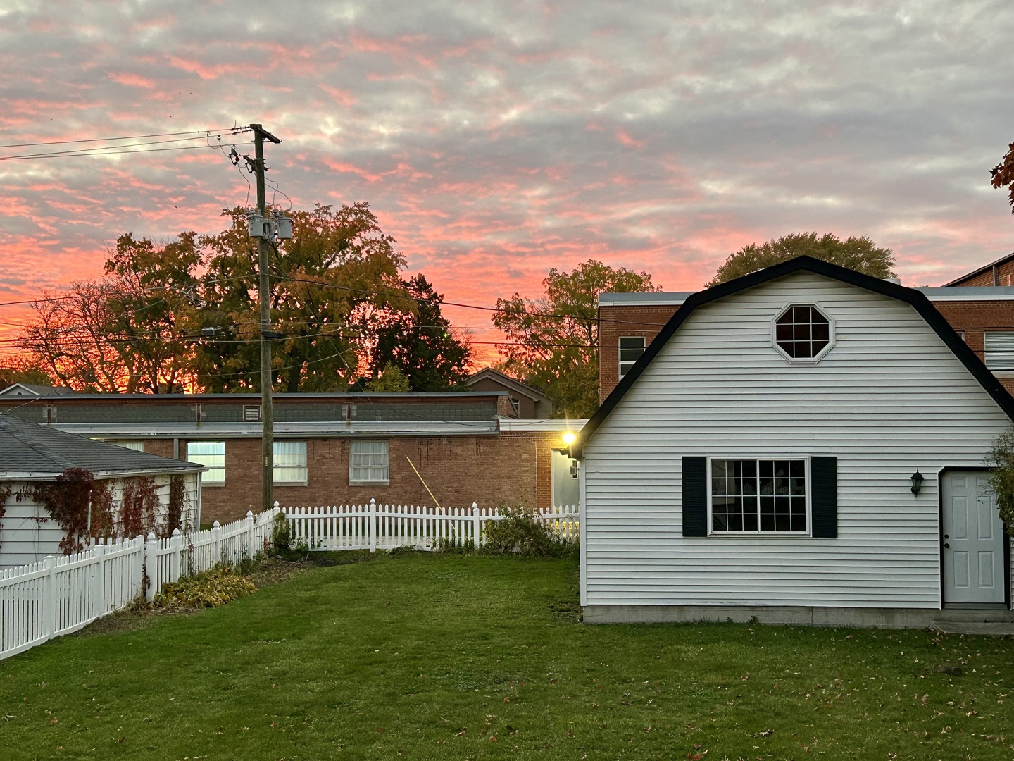 8542 School Street Morton Grove, IL 60053 - Photo 26 of 28 a front view of a house with a garden