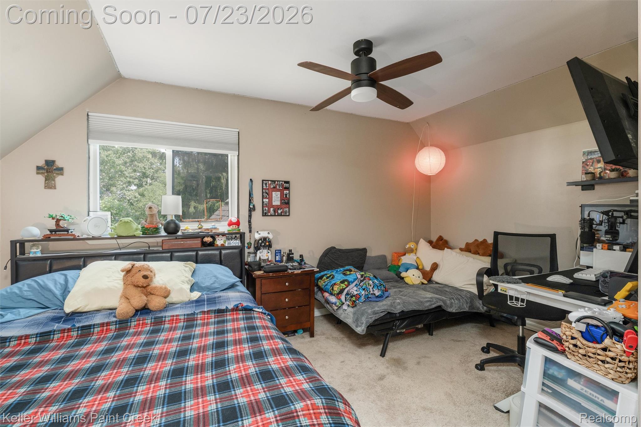 2611 Quail Run Street Rochester, MI 48306 - Photo 20 of 48 Inviting room featuring sloped ceilings, a wide window, and neutral wall tones