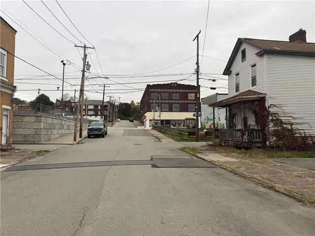 a view of a street with cars