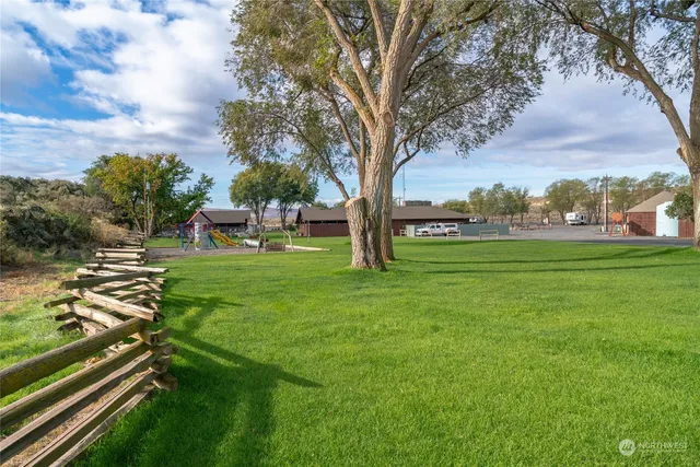 a view of an outdoor space and tennis court
