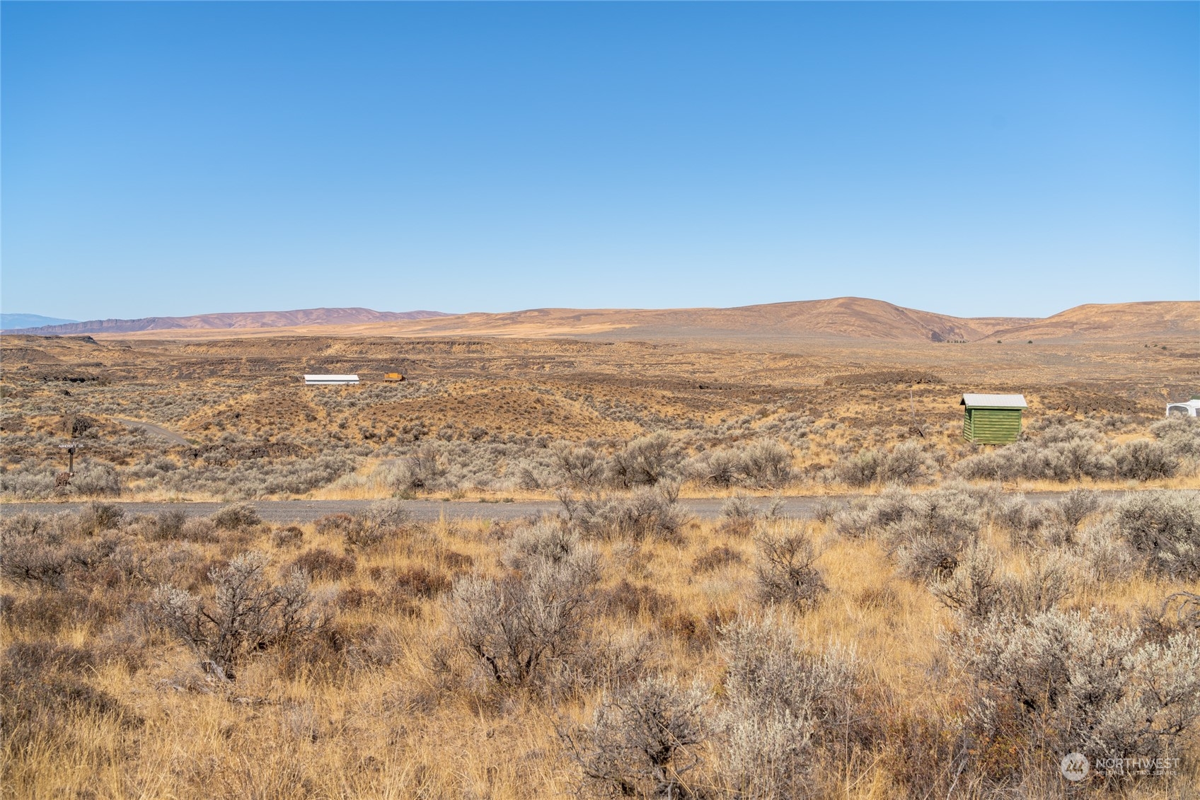 7 Ashcroft Drive Ephrata, WA 98823 - Photo 7 of 8 an aerial view of houses with yard and mountain view in back