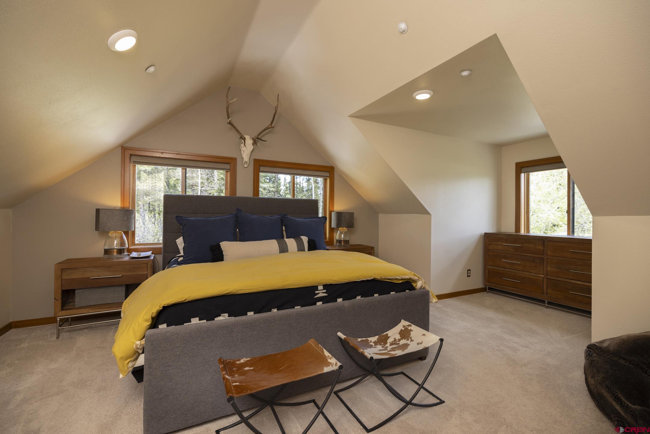 154 Falcon Ridge Road Durango, CO 81301 - Photo 23 of 42 a bedroom with a bed and window
