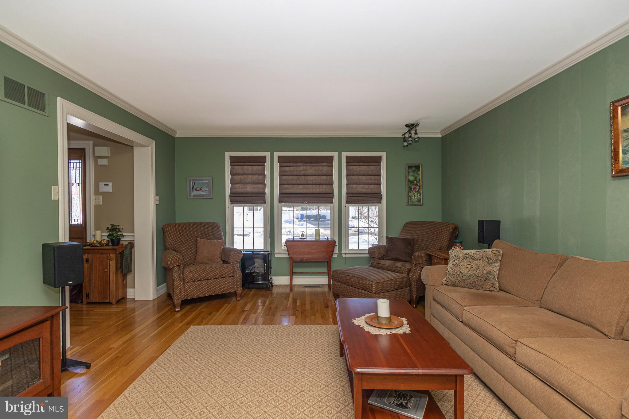 895 Slate Hill Road Yardley, PA 19067 - Photo 11 of 67 a living room with furniture and large windows