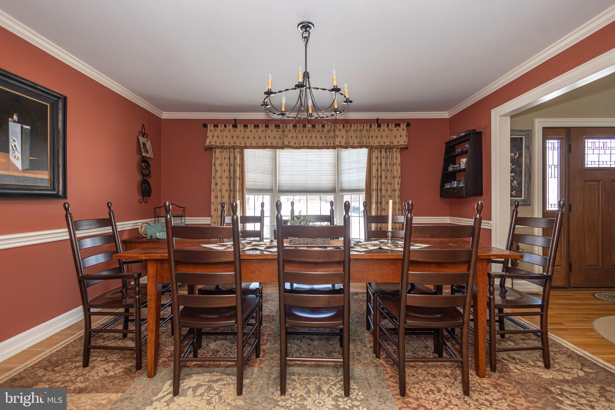 895 Slate Hill Road Yardley, PA 19067 - Photo 17 of 67 a dining room with furniture a chandelier and window