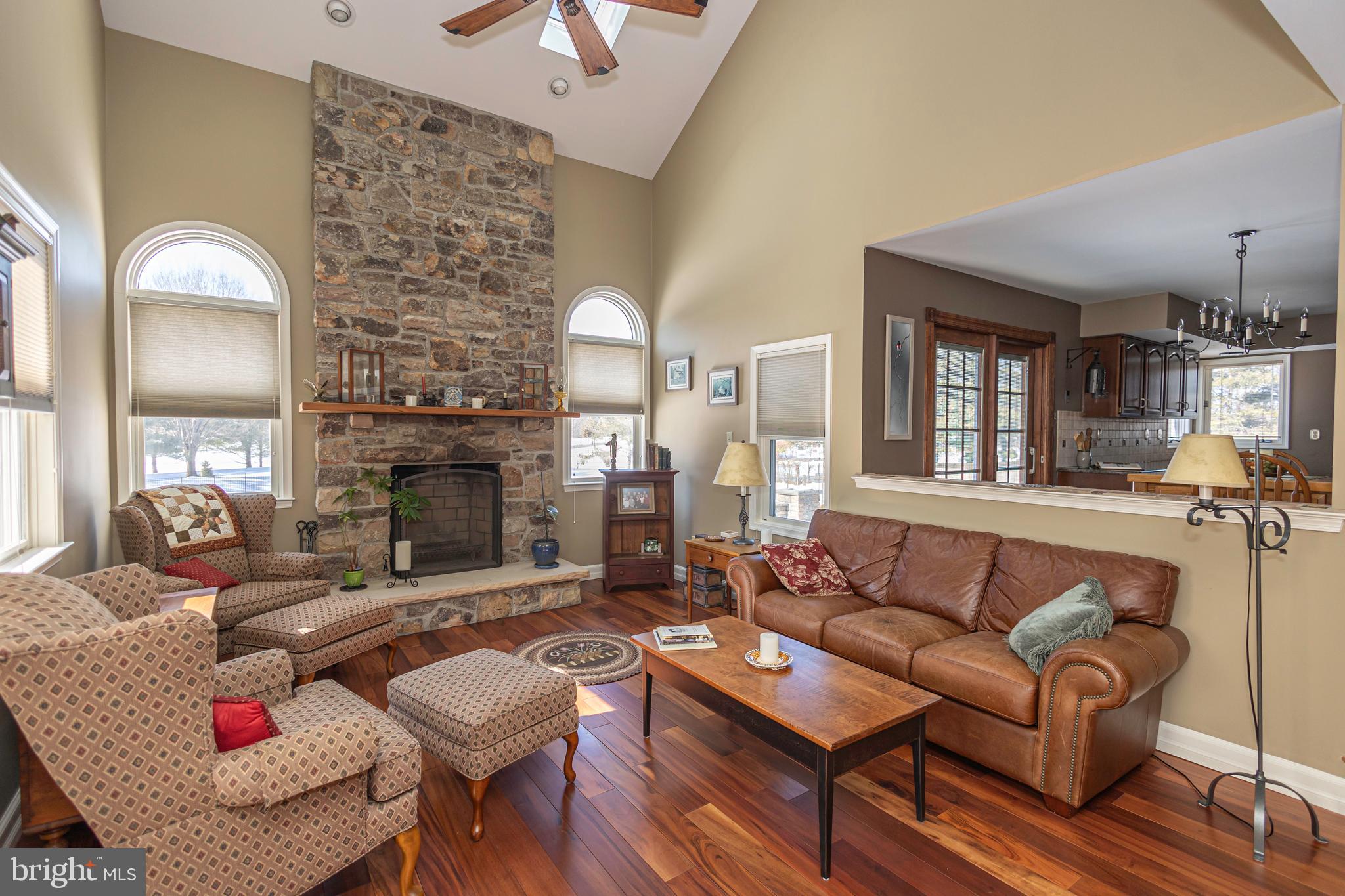 895 Slate Hill Road Yardley, PA 19067 - Photo 32 of 67 a living room with furniture fireplace and a fireplace
