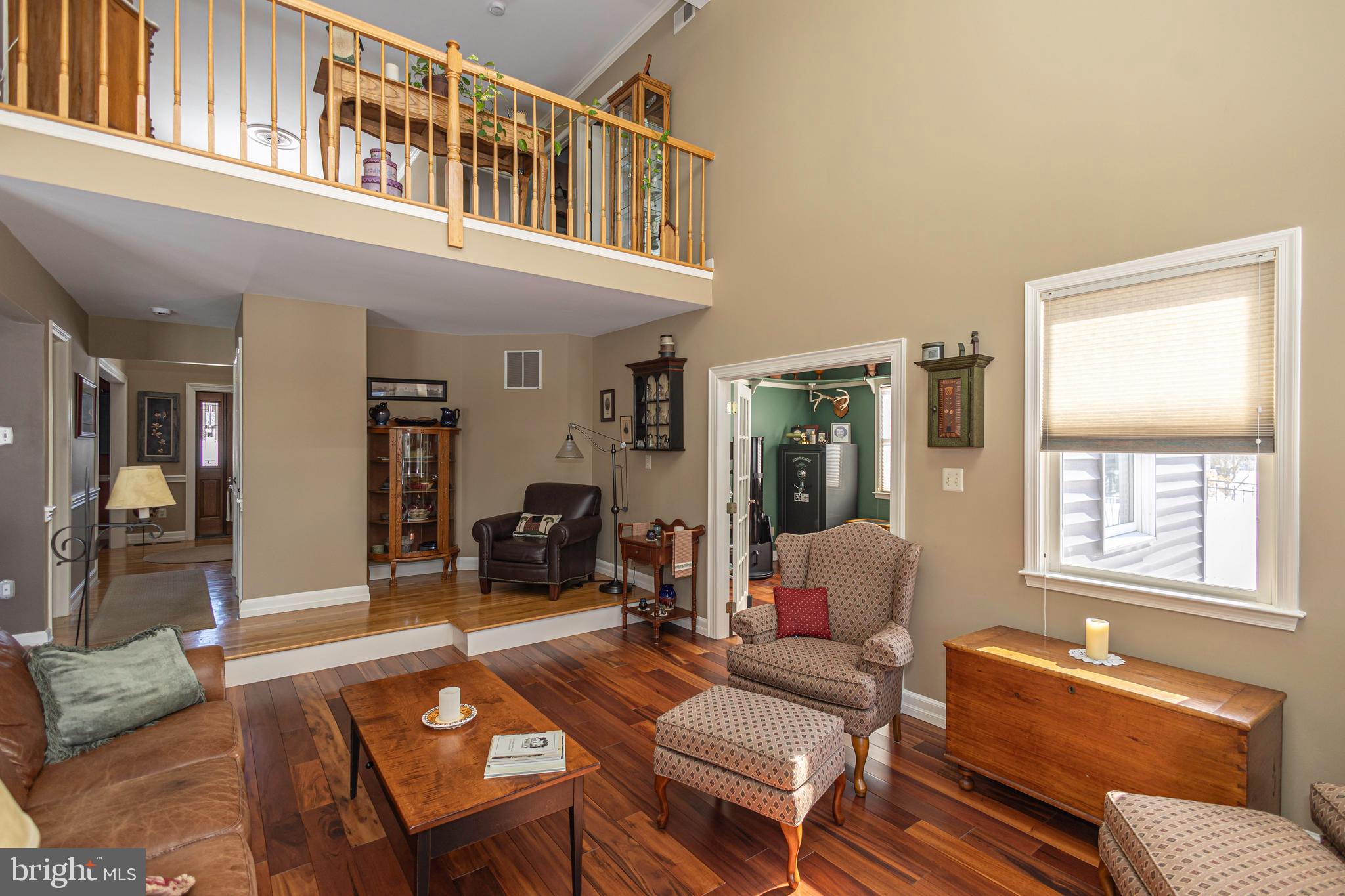 895 Slate Hill Road Yardley, PA 19067 - Photo 38 of 67 a living room with furniture a dining table and a window
