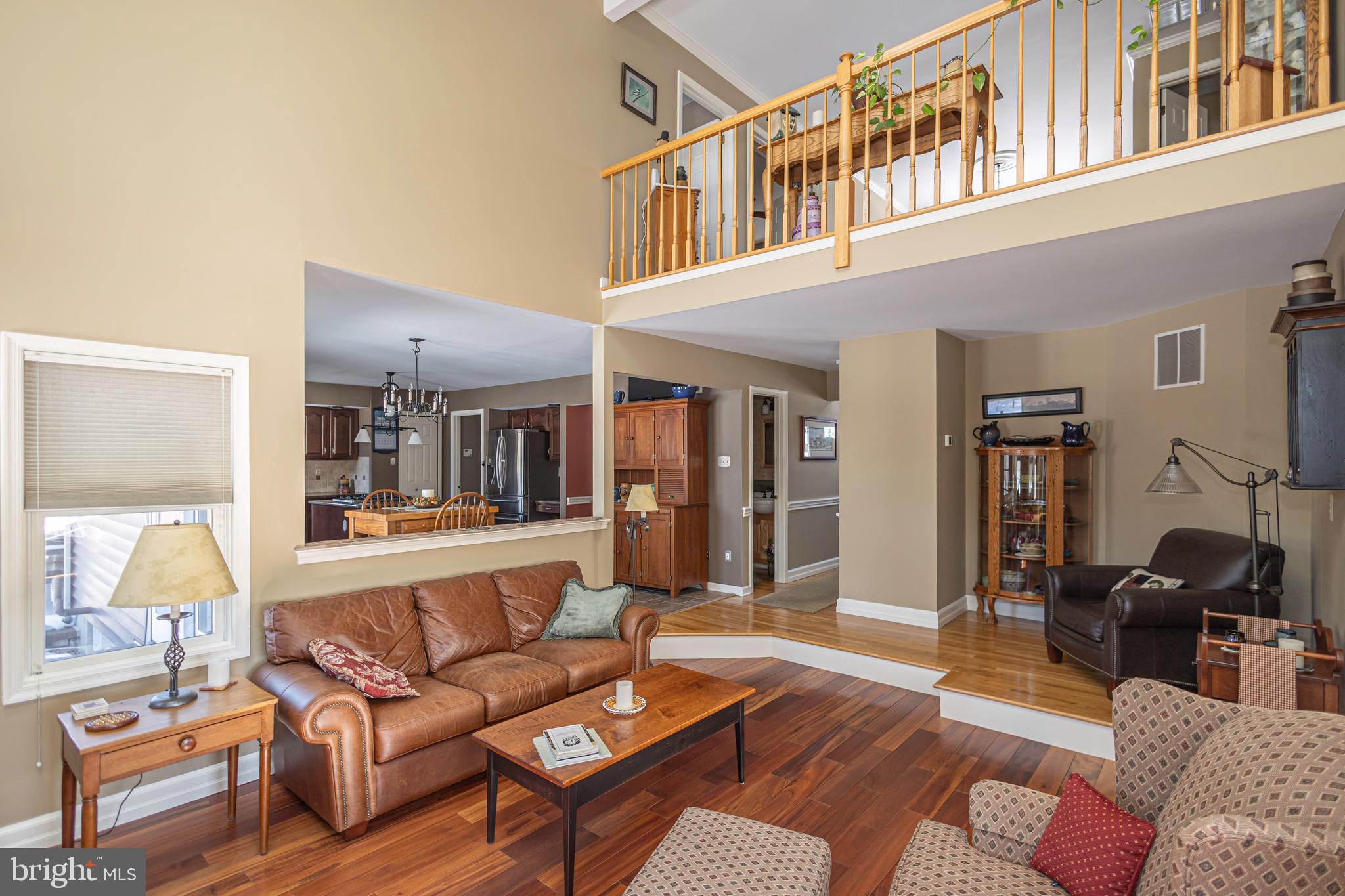 895 Slate Hill Road Yardley, PA 19067 - Photo 39 of 67 a living room with furniture and a lamp