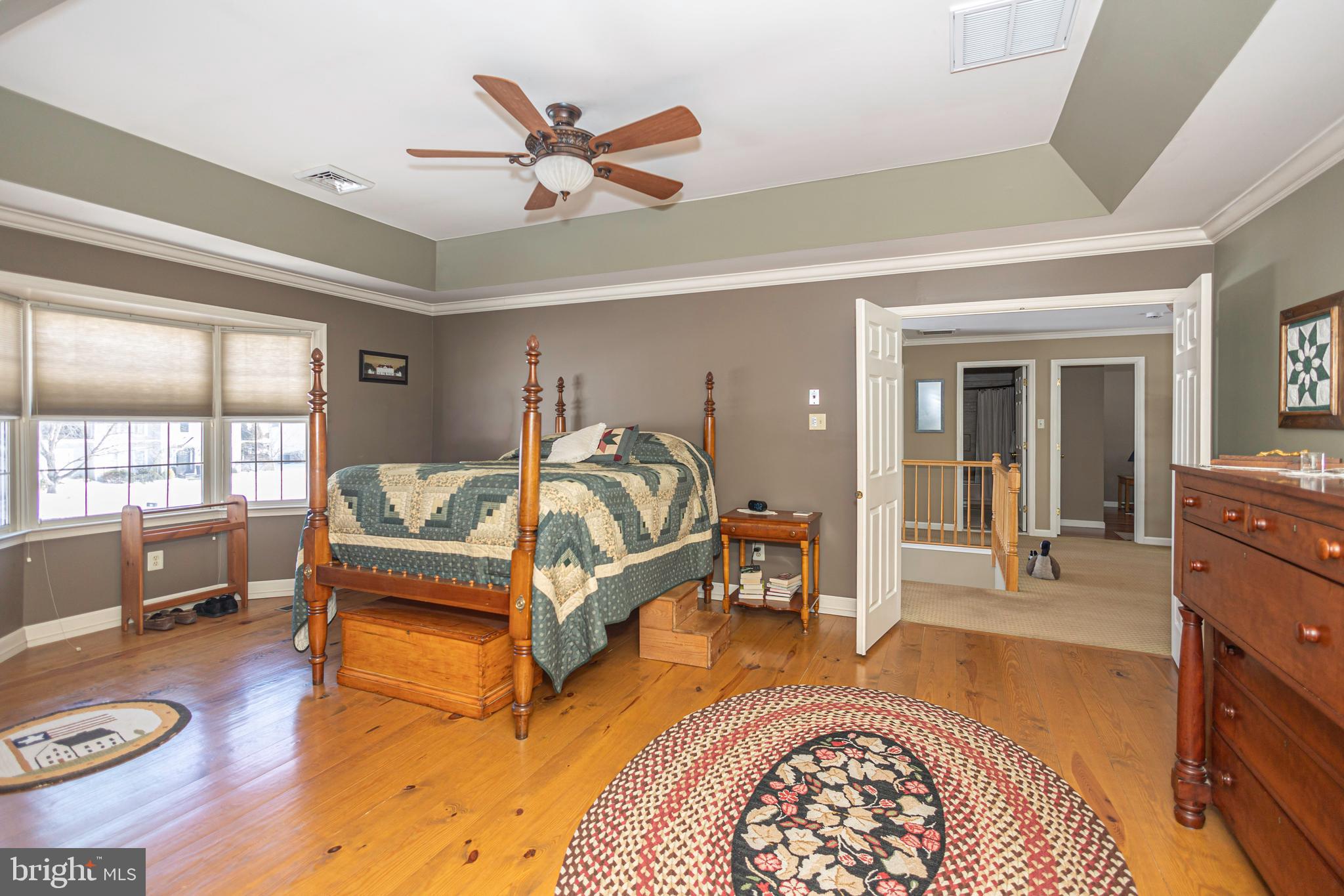 895 Slate Hill Road Yardley, PA 19067 - Photo 48 of 67 a bedroom with a bed and wooden floor