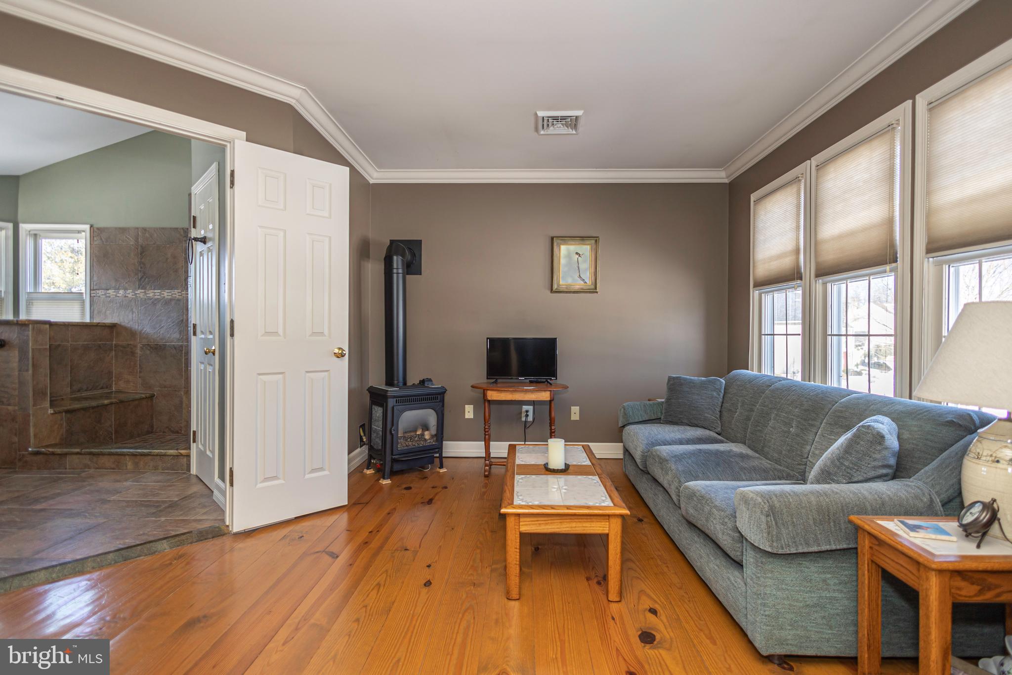 895 Slate Hill Road Yardley, PA 19067 - Photo 49 of 67 a living room with furniture and a flat screen tv