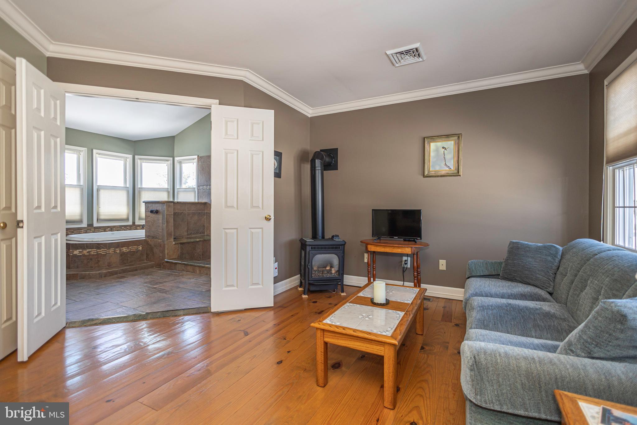 895 Slate Hill Road Yardley, PA 19067 - Photo 50 of 67 a living room with furniture and a flat screen tv